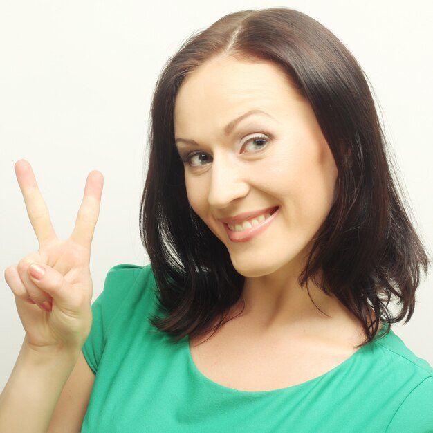 woman-showing-two-fingers_118342-7128